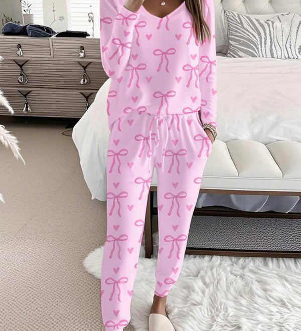 HALLIET - V-Neck Long Sleeve Top with Bow Print