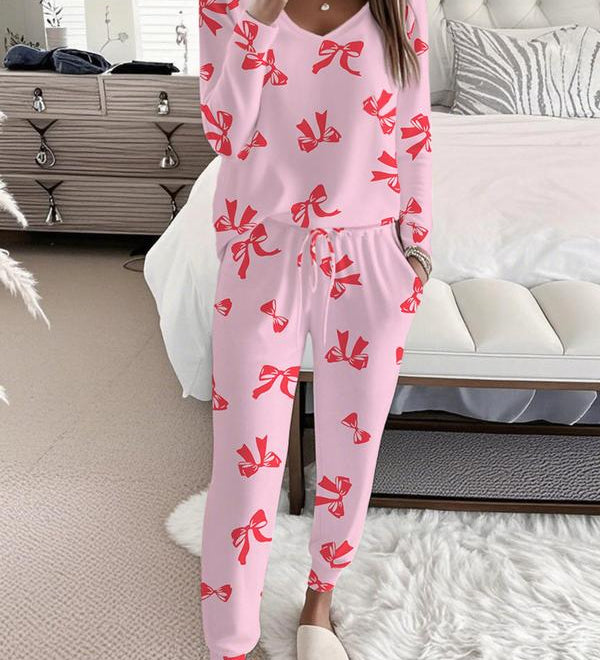 HALLIET - V-Neck Long Sleeve Top with Bow Print