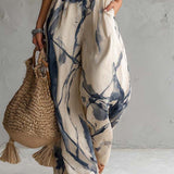 Sabryna - Halter Jumpsuit with Ink Print Design